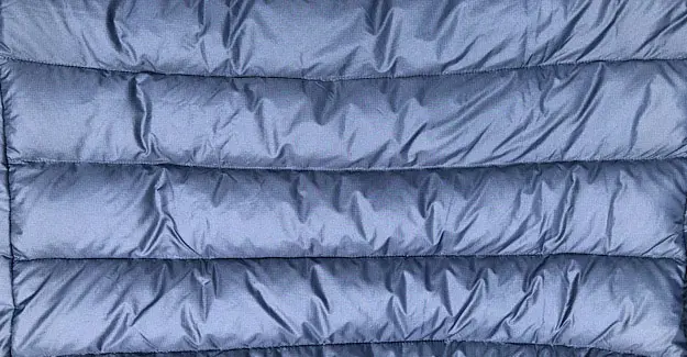 The jacket has the larger baffles for more loft and warmth