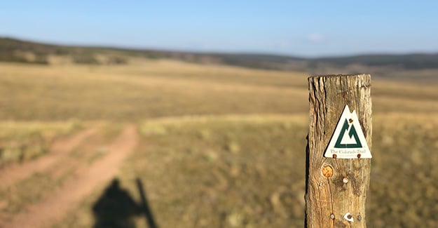 Colorado Trail Emblem on Post by Trail