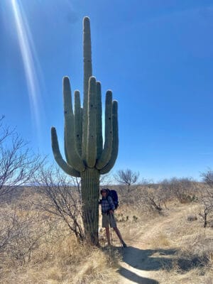 Average Hiker posing with a Saguaro Cactus on the Arizona Trail