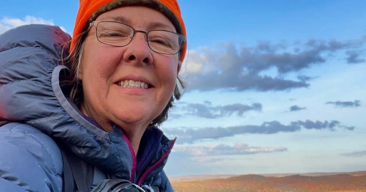 Average Hiker on the Superior Trail in fleece Hat and Feathered Friends EOS jacket.