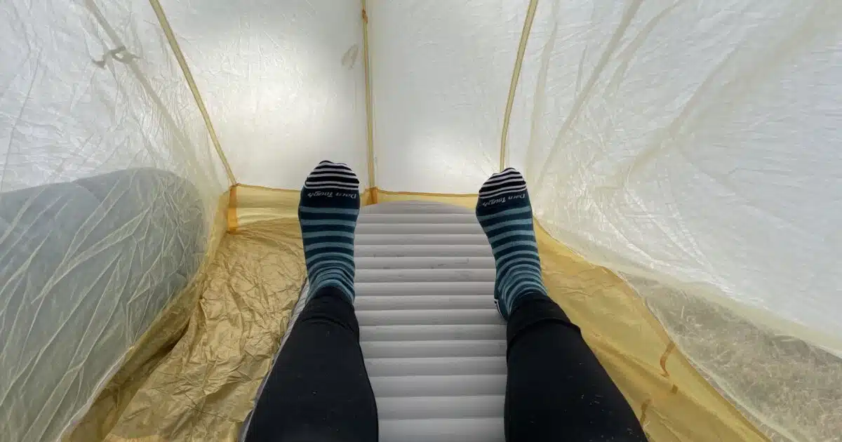 Interior of tent with pad and my legs to show roominess.